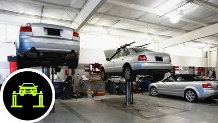 Range of servrices - Three cars in a garage on car lifts